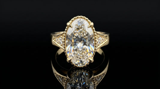 custom made engagement ring in 18k yellow gold with 5 carat moval diamond