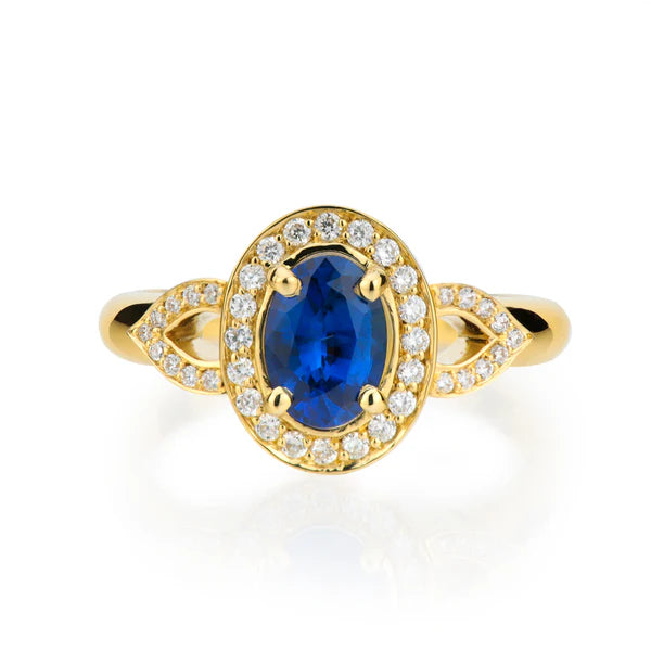 Sapphire halo engagement ring with diamond surround in white gold, handcrafted by Davidson Jewels
