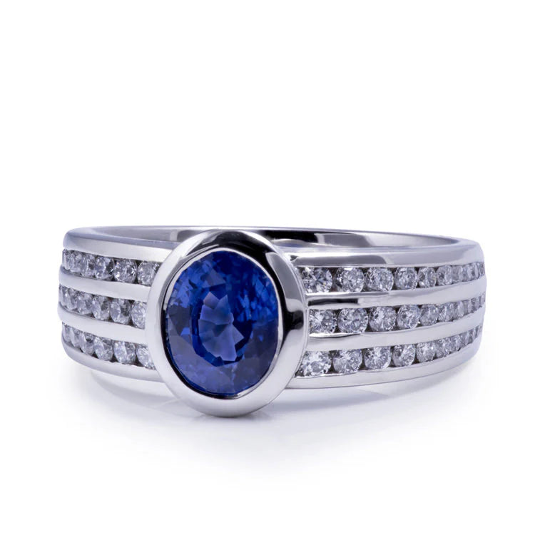 Custom blue sapphire ring in yellow gold, handcrafted at Davidson Jewels studio in Calgary