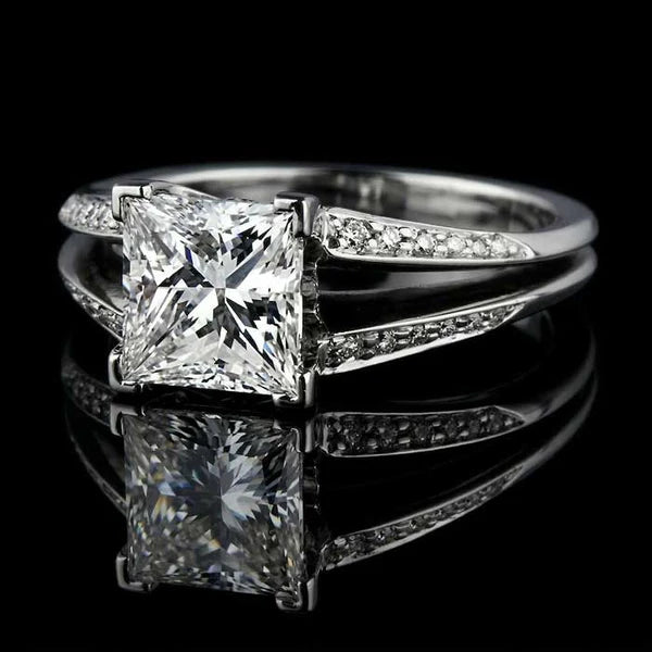 Custom princess cut diamond engagement ring with split shank and pavé band, handcrafted in Calgary by Ian Davidson
