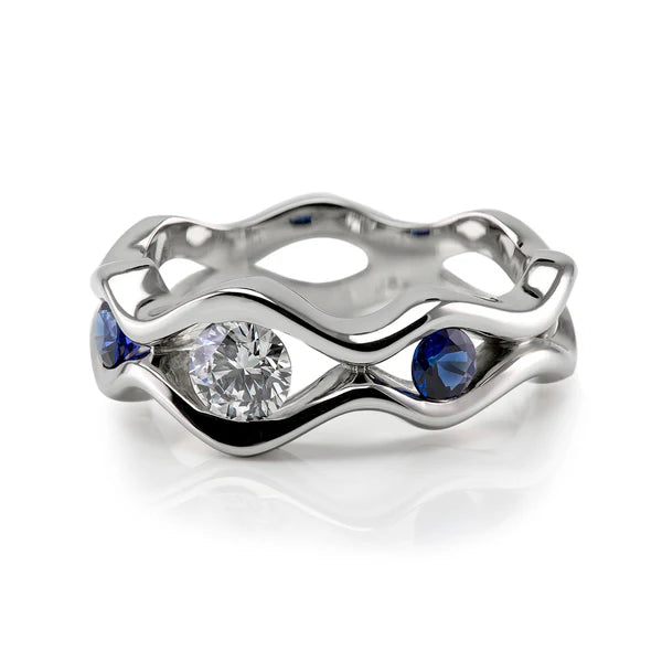 Sapphire and diamond wave engagement ring in white gold, handcrafted by Ian Davidson